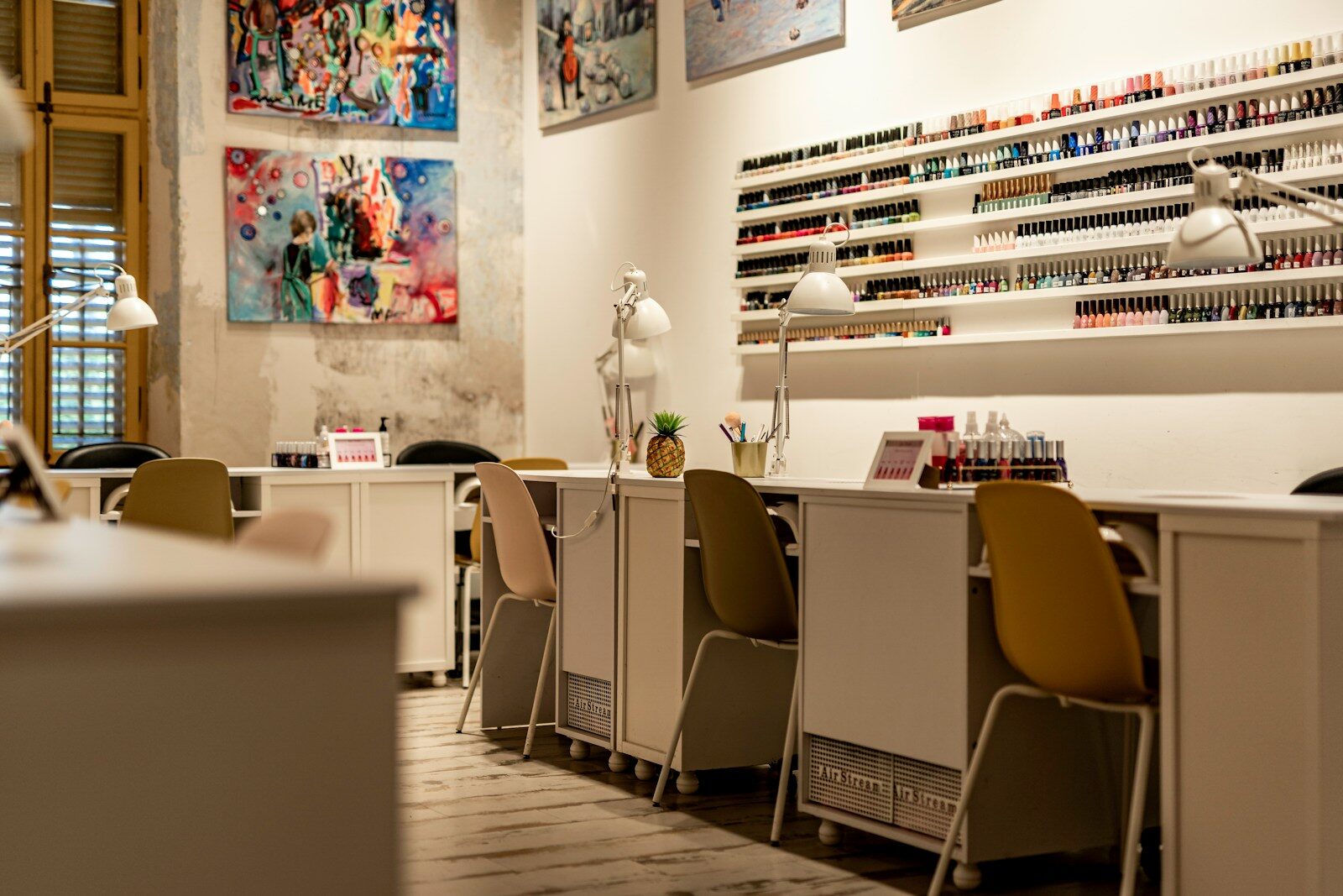 a nail salon with chairs and a counter